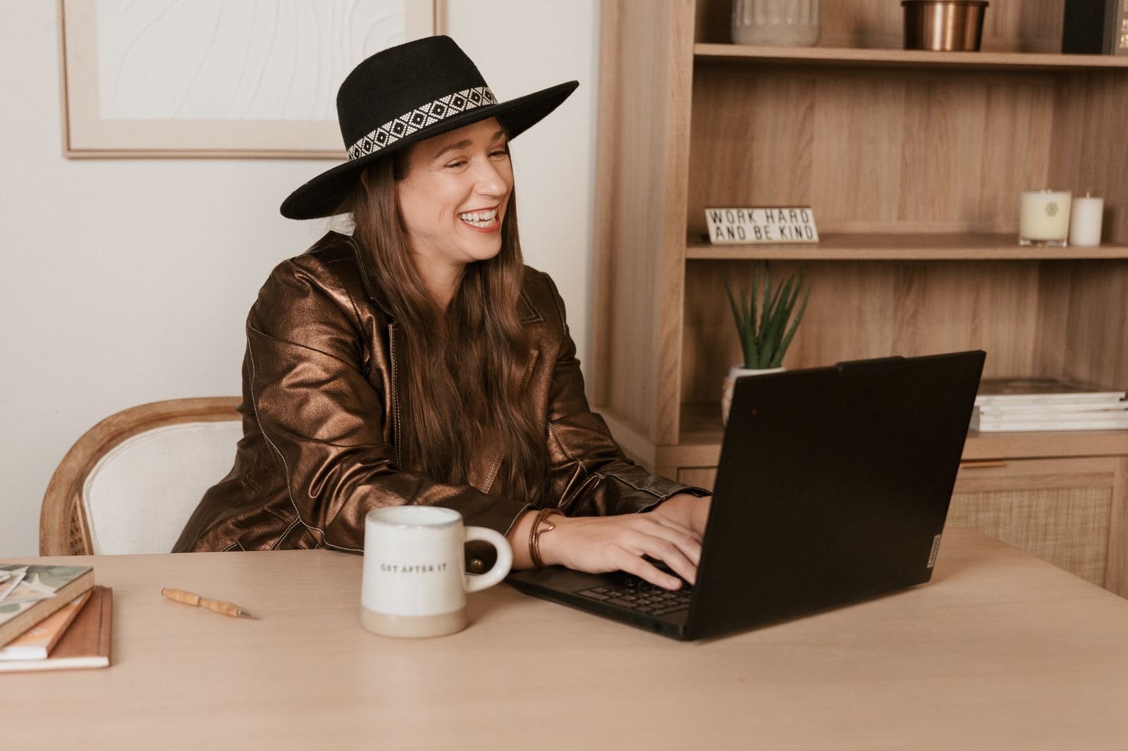 Kristin Winstanley working on her laptop at her desk